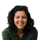 person with green shirt and long black hair